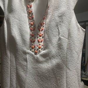 White sleeveless dress with side zipper.